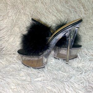 A clear platform heel, with black fur